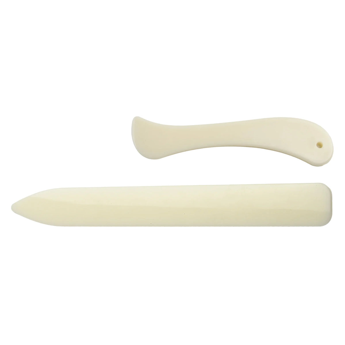 A white plastic bone folder used for paper creasing and folding crafts.