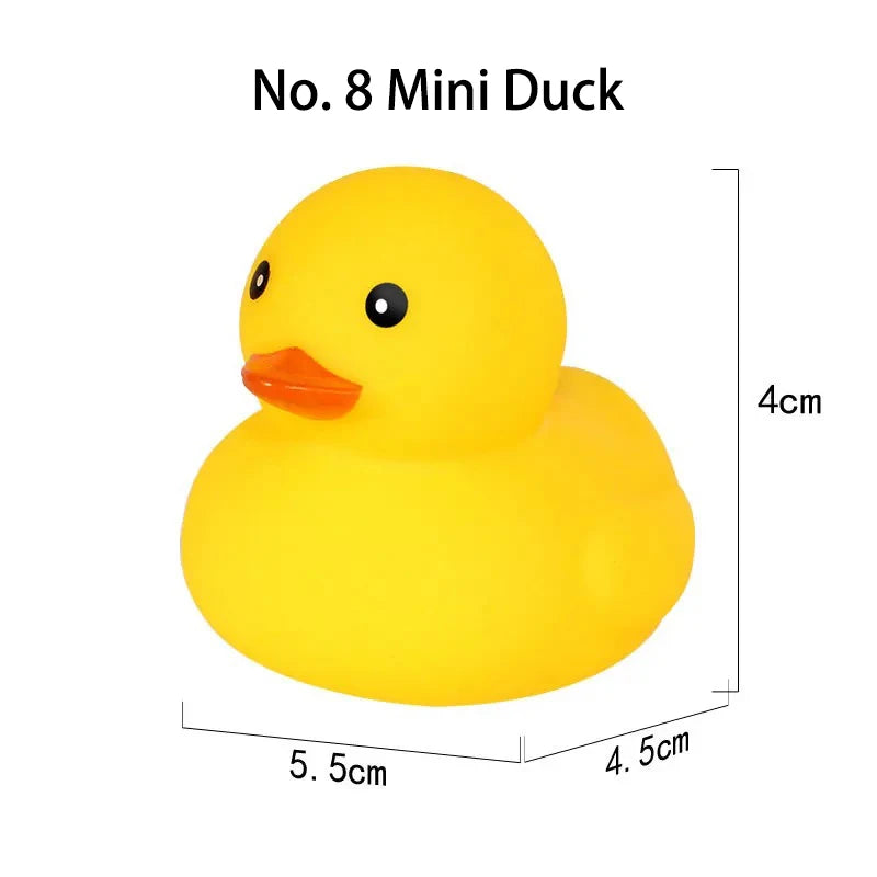 A yellow mini rubber duck with an orange beak and black eyes.