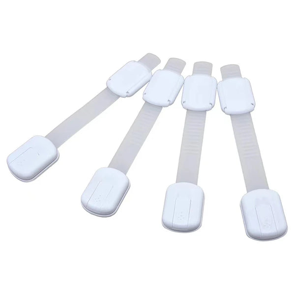 A set of white adjustable child safety cabinet locks with plastic straps and mounting plates.