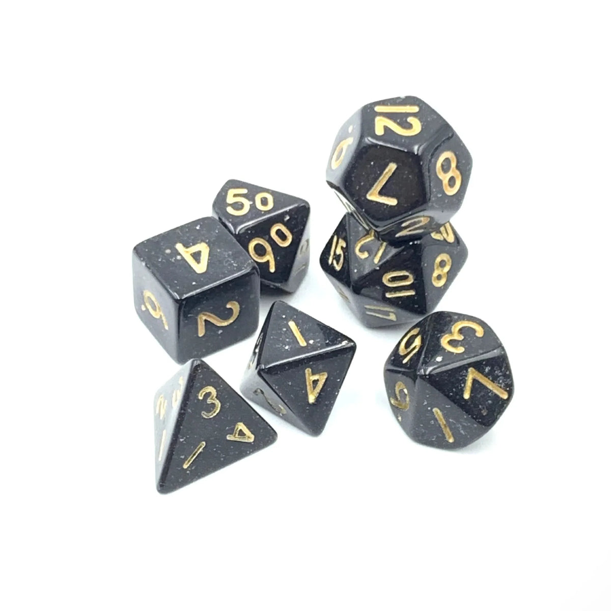 A set of seven 10mm transparent acrylic dice, including a dodecahedron and several other polyhedral shapes.