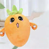 An orange fruit plush toy with a green leafy top and large eyes, hanging against a white background.