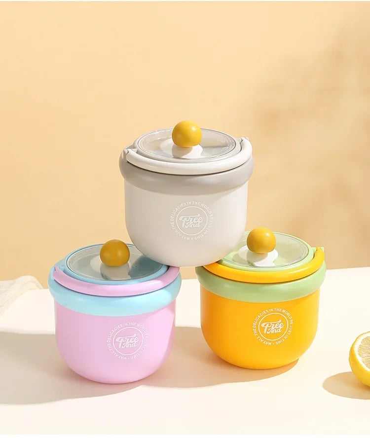 A set of colorful insulated stainless steel breakfast cups with lids in pink, light gray, and yellow.