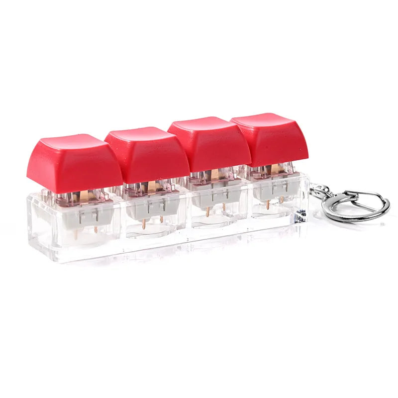 A clear acrylic keychain featuring four red clicky key buttons for fidget use.