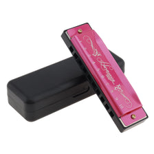 A pink 10-hole diatonic harmonica in C with a black carrying case.
