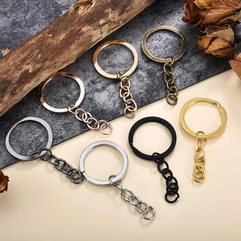 A collection of gold and silver geometric silicone mold sets for epoxy resin earrings and pendants displayed on a neutral sur