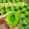A hand holds a bright green watermelon kiwi squishy stress ball fidget toy with a clear background.