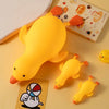 A bright yellow jumbo squishy duck stress ball fidget toy resting on a light background.