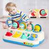 A child is playing with a colorful peekaboo pop-up animal toy featuring various animals and cause and effect learning element