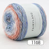 A skein of gradient rainbow yarn labeled Fairyland long distance cake ball