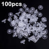 A pile of 100 clear silicone earring backs for secure stud closure.