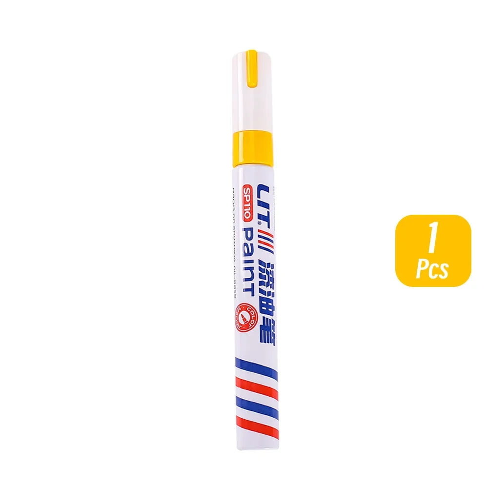 A single tube of permanent paint markers with an orange cap and white body, featuring striped accents.