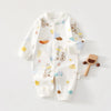 White cotton long sleeve baby romper featuring spring and autumn themed illustrations like bicycles, clouds, and rainbows.