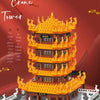 An orange and yellow micro building block model of the Yellow Crane Tower structure.
