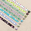 A collection of 27 assorted colored origami star strips for DIY crafting and decor arranged diagonally on a light background.