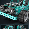 A detailed model of an off-road vehicle built from metal building blocks, featuring large tires and a rugged chassis.