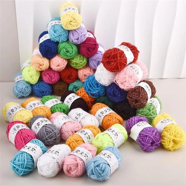 A pyramid display of 12 colors of acrylic yarn for knitting and crochet projects.