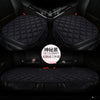 A set of three black quilted car seat cushions for winter warmth shown in a vehicle interior.