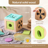 A wooden tissue box toy for toddlers showing the fine outer edge of the wood and a painted green section.