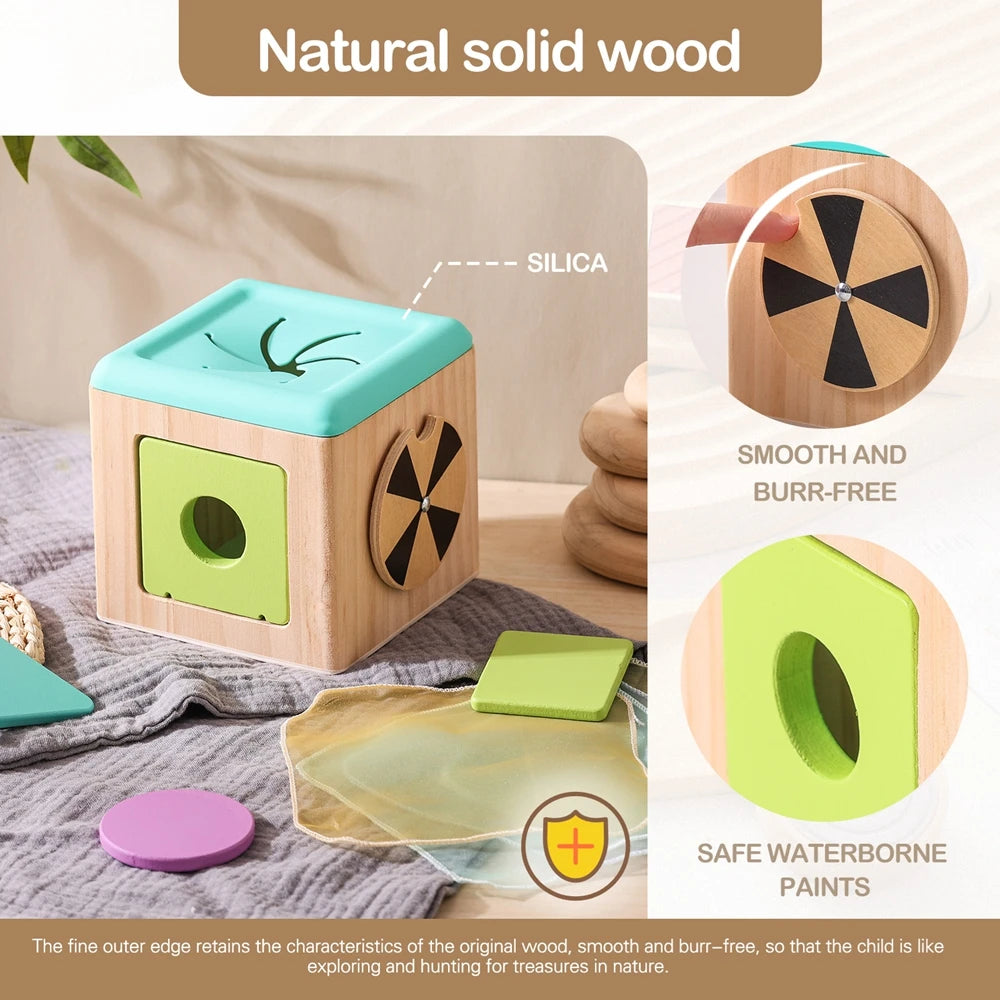 A wooden tissue box toy for toddlers showing the fine outer edge of the wood and a painted green section.