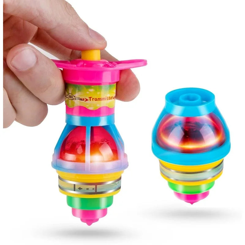 A hand holds a glowing spinning top toy with multiple colored LED lights.