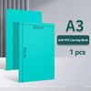 A stack of A3 size turquoise soft PVC carving blocks with dimensions 30cm by 40cm shown on a white surface.