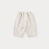 A pair of cream-colored knit sweater and pants set for a toddler.
