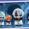A set of chibi figurines depicting four Fatui Harbingers with white hair and dark clothing in a display box.
