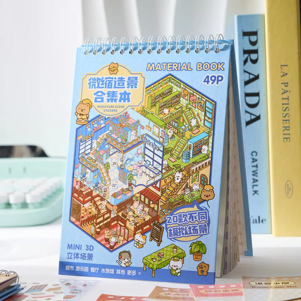 A blue spiral-bound book titled Material Book 49P featuring stickers and illustrations of miniature scenes.