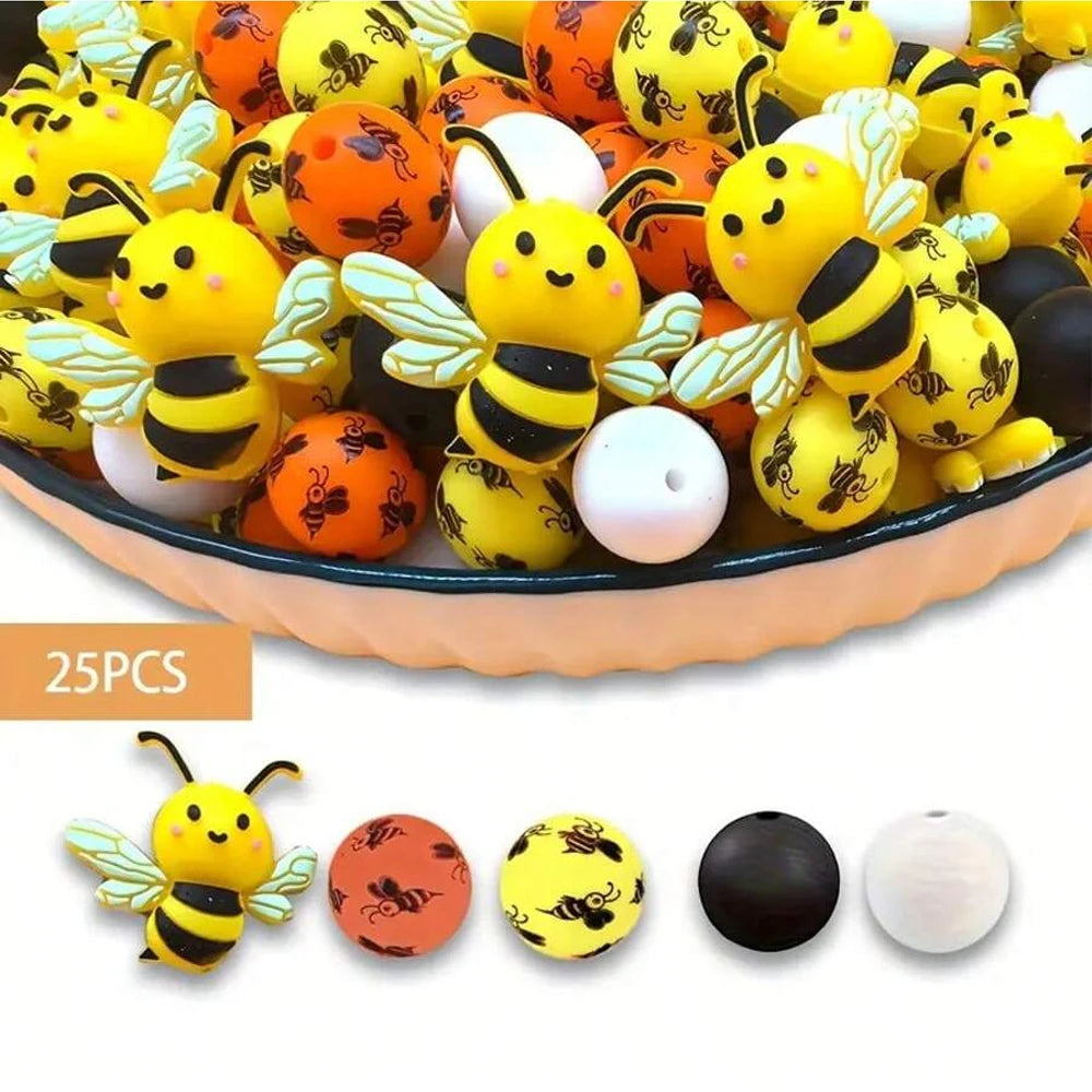 A bowl filled with colorful 3D bee silicone beads in yellow, orange, and white for DIY crafts.