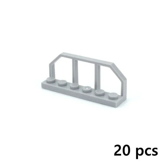 A set of twenty gray plastic motor and servo pieces for building blocks.