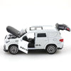 A white 1:36 scale die-cast metal SUV toy with opening doors and pull-back action.