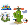 A green cactus sprinkler toy with orange sprayers and a base, shown next to its packaging.