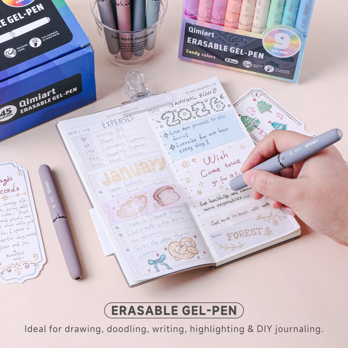 A set of colorful erasable gel pens with an eggshell design lying on a notebook and stationery.