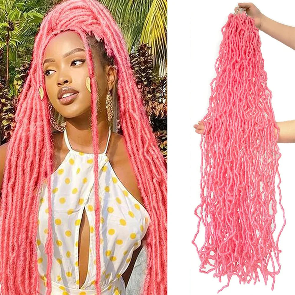 A woman models long, bright pink faux locs crochet hair with a white top and yellow accents.