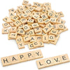 A pile of wooden alphabet letter tiles in various sizes and orientations.