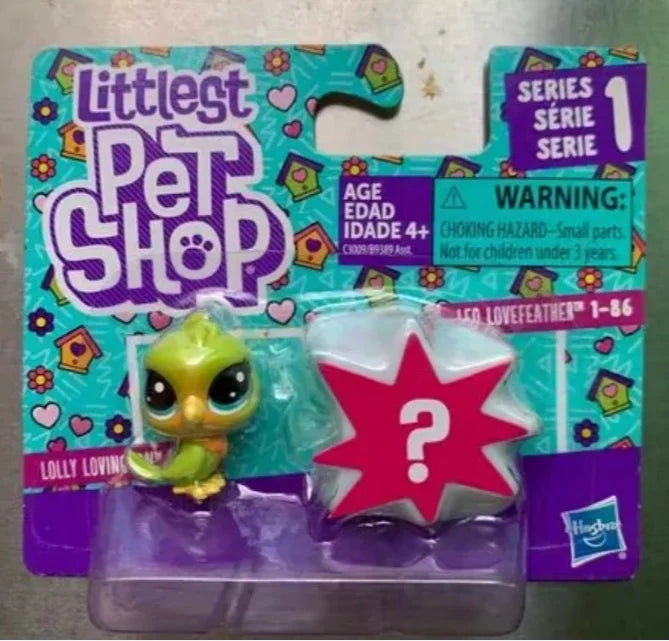 A packaged set of Little Pet Shop figures featuring a lime green animal and a red star shape.