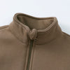 A close-up of a brown fleece hooded jacket with a ribbed collar and a zipper detail.