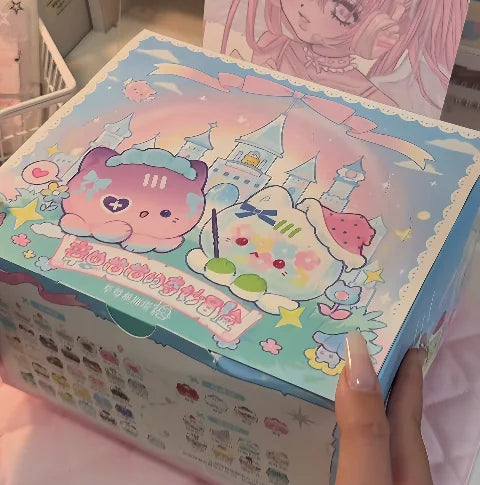 A colorful blind box featuring a strawberry mousse tower and an octopus cat pendant charm.