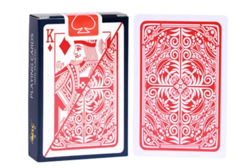 A box of red playing cards featuring a king design and intricate patterns.