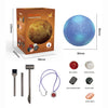 A box containing a Mercury planetary mining kit with tools and various gemstones like jasper, crystal, lava stone, jade, and 