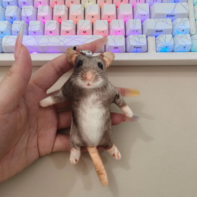 A hand holds a lifelike skeleton plush toy resembling a small rodent or pet.