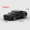 A black classic supercar model built from building blocks, shown in a side view.
