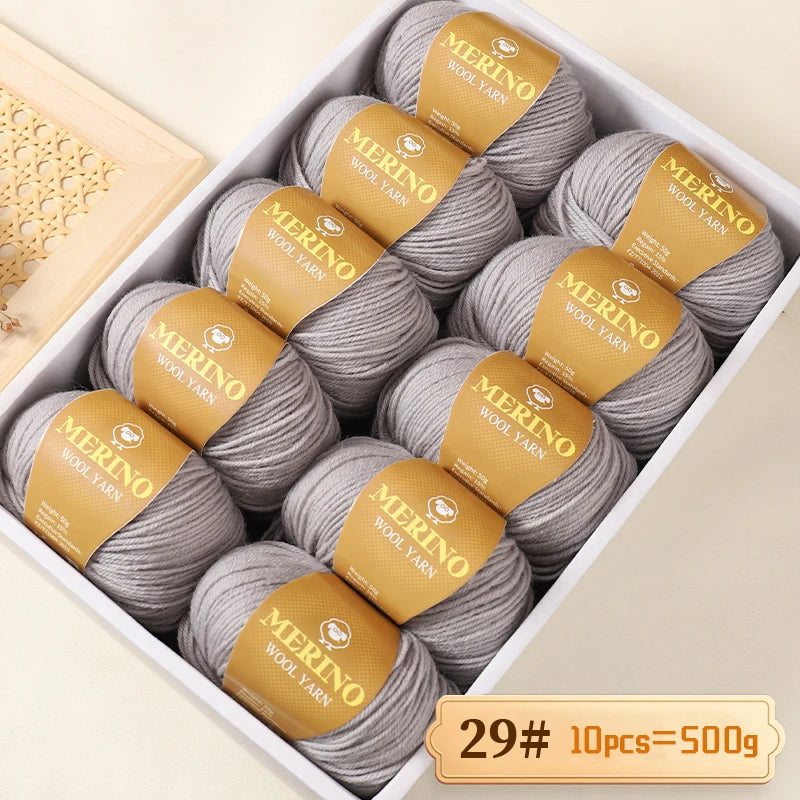 A box of Merino wool yarn balls with yellow labels showing the weight 29# and quantity 10 pieces totaling 500g