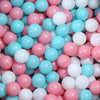 A close-up view of a large pack of colorful plastic balls in pink, white, and light blue shades.