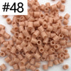 A pile of 1000 small, cylindrical fuse beads in assorted light pink and beige colors for craft projects.