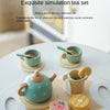A Hipster style exquisite simulation tea set featuring a mint green teapot and accompanying accessories on a wooden tray.