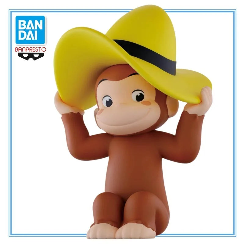 A collectible figure of Curious George wearing a yellow cowboy hat and brown body.