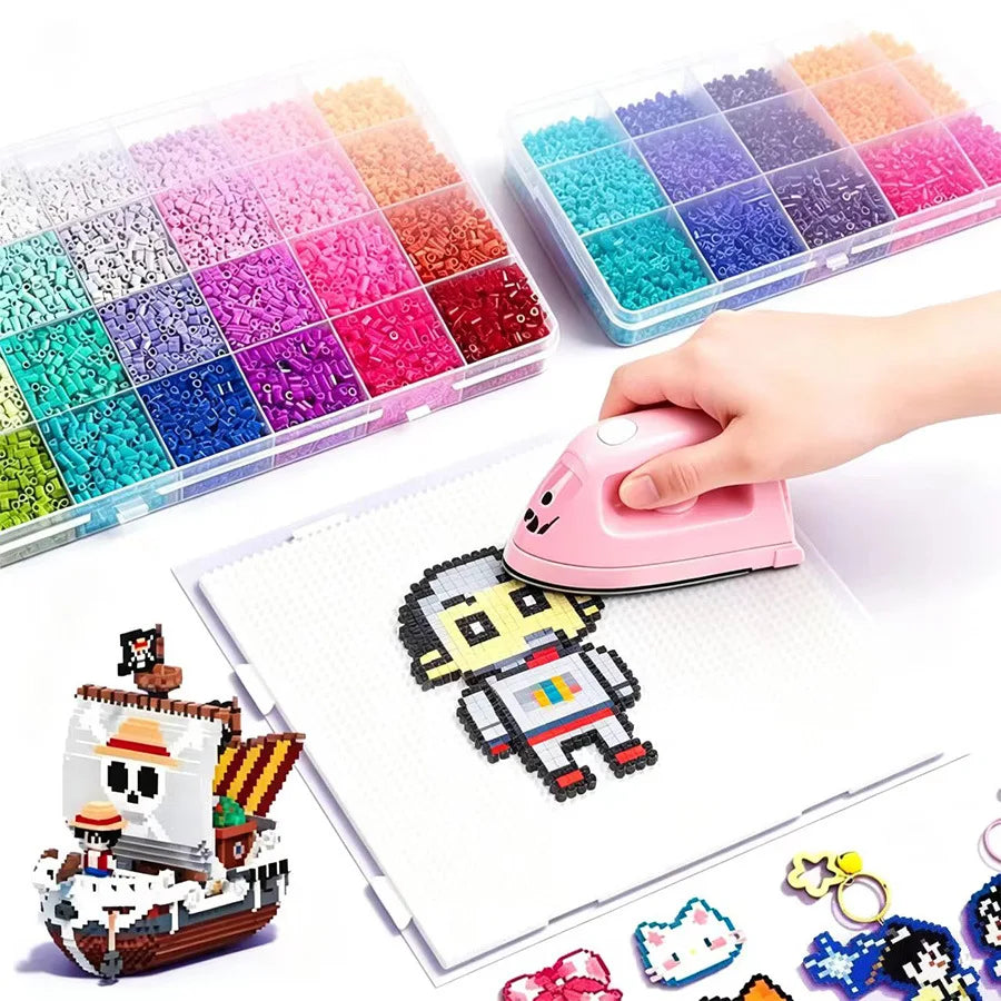 A hand holds a pink Perler bead kit next to a white crafting mat showing a finished design.