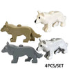 A set of four marine animal building blocks including a white whale, a tan elephant, a gray shark, and a light gray wolf.