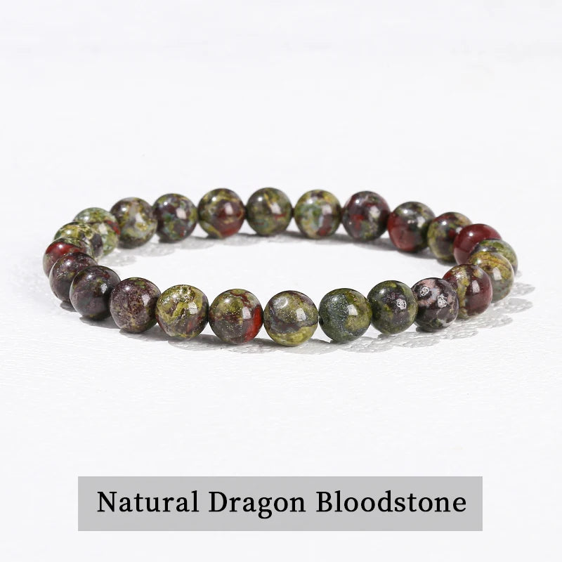 A bracelet made of natural dragon bloodstone beads in various shades of pink and green.